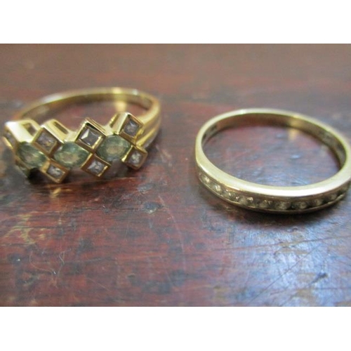 57 - Four 9ct gold rings, two set with diamonds and the other coloured stones, and one set with a tiger's... 