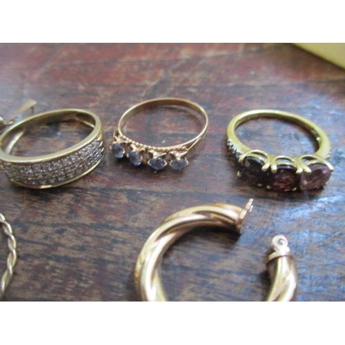 60 - Three pairs of gold coloured earrings, a gold coloured metal ring and two silver gilt rings and a cr... 