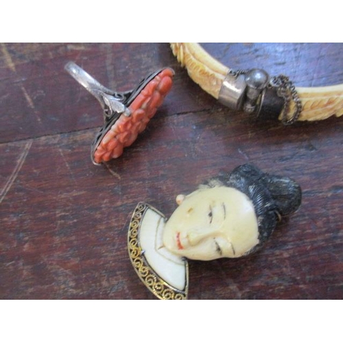 67 - Chinese and other jewellery to include an ivory bracelet, a brooch fashioned as a face and a coral r... 