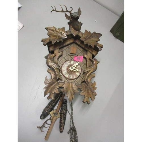 76 - A modern Black Forest carved cuckoo clock, 12