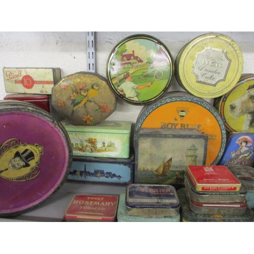 79 - A quantity of vintage tins to include biscuit tins, commemorative tins and late 20th Century tobacco... 