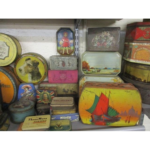 79 - A quantity of vintage tins to include biscuit tins, commemorative tins and late 20th Century tobacco... 