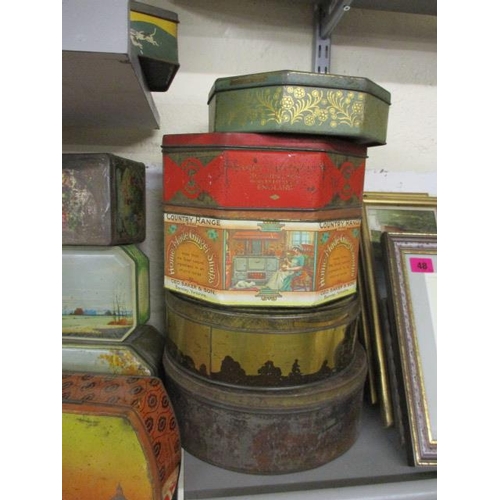 79 - A quantity of vintage tins to include biscuit tins, commemorative tins and late 20th Century tobacco... 