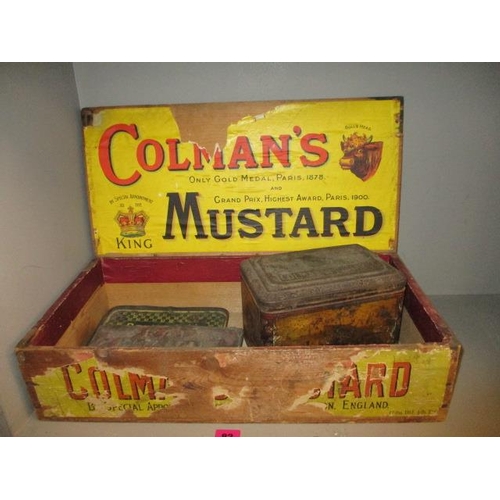 82 - A vintage Colmans advertising crate together with a vintage Colmans tin and vintage tin lids