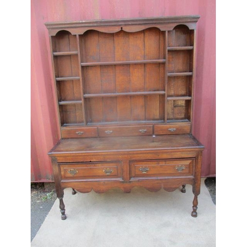 364 - An 18th century and later oak dressing chest, the upper part having eight shelves and three drawers,... 