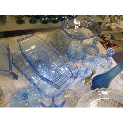 215 - A selection of blue glassware to include candlesticks, bowls and various other glasses