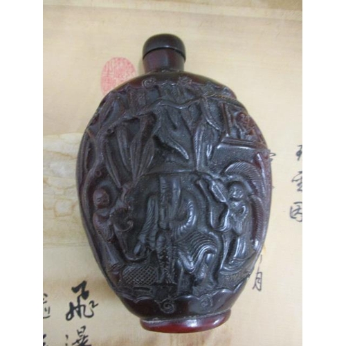 226 - A Chinese resin perfume bottle, together with three Chinese scroll prints