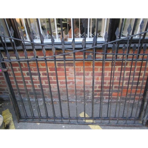 254 - A pair of wrought iron black painted drive way gates and a pair of matching smaller gates