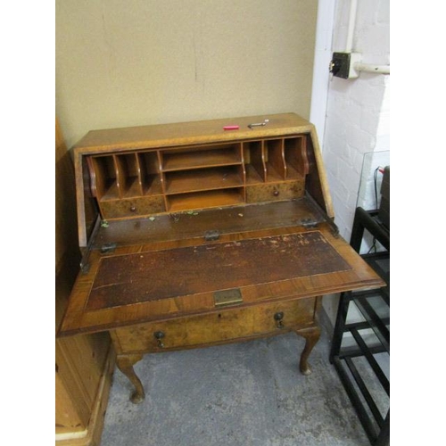 255 - A 1930s quarter cut walnut veneered Queen Anne style bureau with fitted interior, the fall flap is b... 