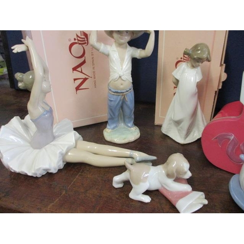 261 - Five pieces of Nao to include one model of a puppy, a seated ballerina figure and three other figure... 