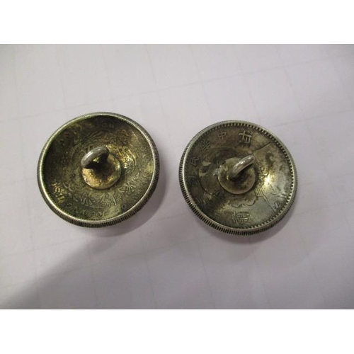 262 - A pair of modern silver plated Chinese buttons