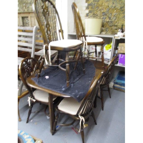 357 - A set of six Windsor stick back chairs with crinoline stretchers and a 1930s mahogany gate leg table... 