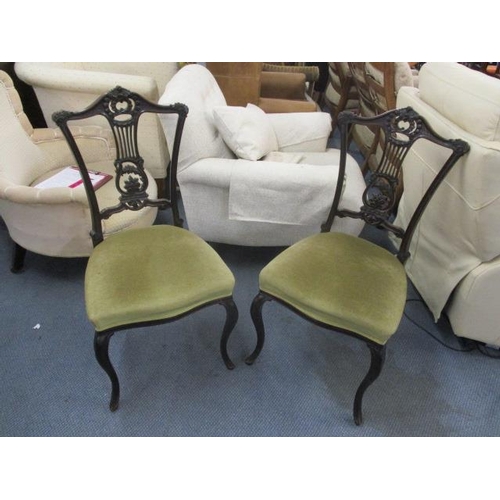 371 - A pair of late Victorian mahogany, pierced, splat back chairs on cabriole legs