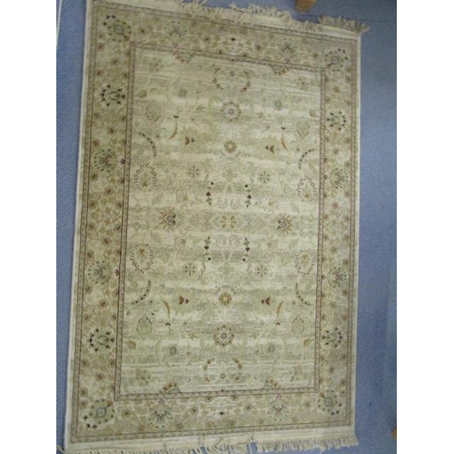 447 - A Marks & Spencer's Egyptian, New Zealand wool rug with floral designs, multi guard borders and tass... 