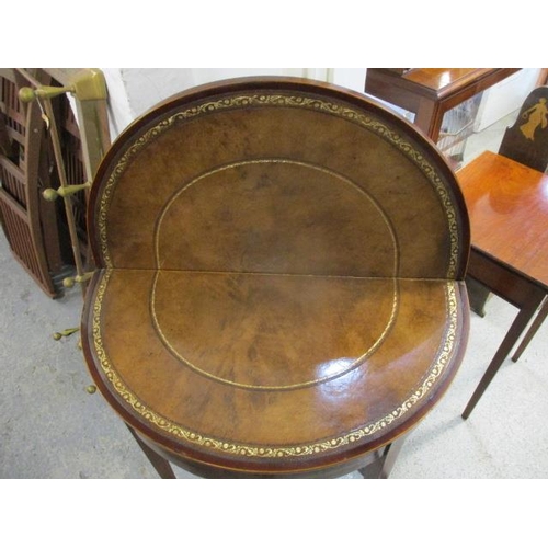 190 - A George III string inlaid mahogany D-shaped card table with a brown leather surface, raised on squa... 