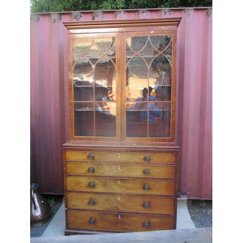 310 - A George II mahogany bookcase cabinet, having moulded cornice over twin glazed doors, above a secret... 