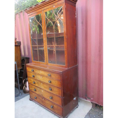 310 - A George II mahogany bookcase cabinet, having moulded cornice over twin glazed doors, above a secret... 