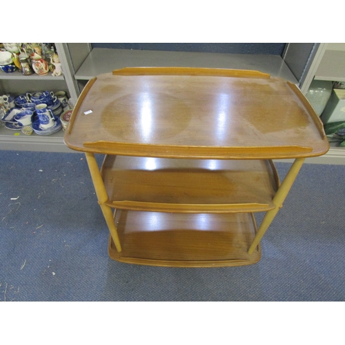 2 - An Ercol blonde elm three-tier tea trolley with galleried top, raised on ball shaped castors, 30 1/2... 