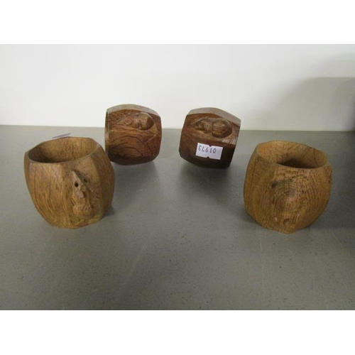 13 - Robert Thompson of Kilburn - a set of four Mouseman oak napkin rings of swollen, octagonal form, eac... 