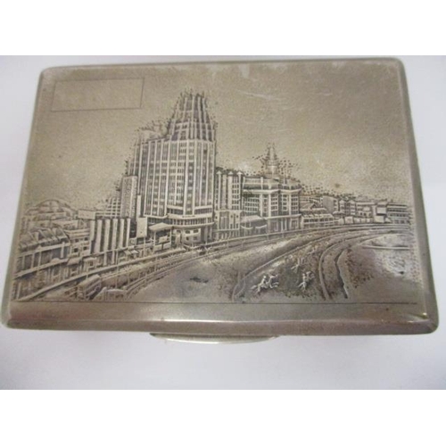 162 - An early 20th century Chinese silver cigarette box by Suikee with textured decoration, the lid embos... 