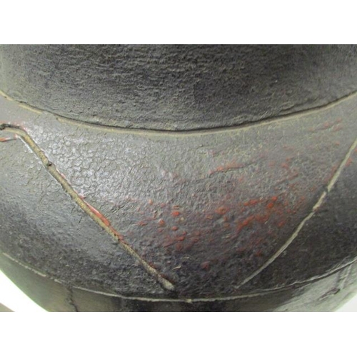 180 - A 19th century South African black, brown/red glazed clay pot with incised decoration, 14