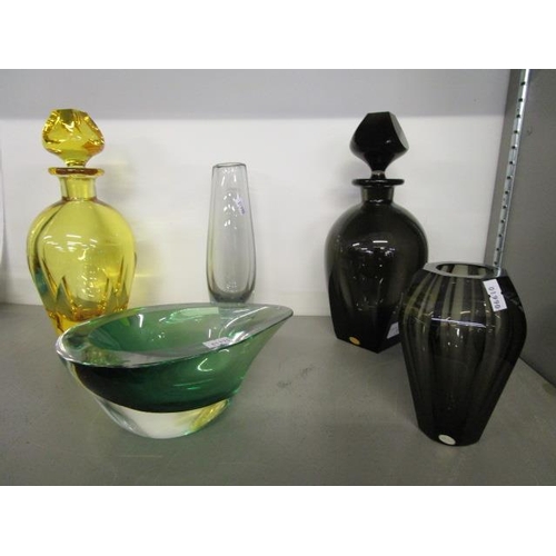 25 - Two Ludwig Moser cut glass decanters and stoppers, one in a dark smokey green, the other in a gold y... 