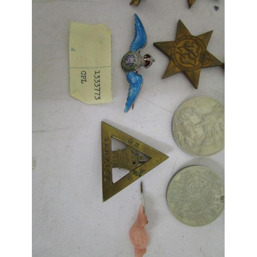 130 - A WWII four medal campaign group comprising 1939-45 Star, Africa Star, British War medal and Defence... 