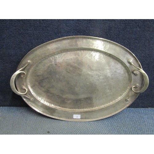 48 - An Arts & Crafts style silver plated oval tray with twin handles and planished decoration, makers ma... 