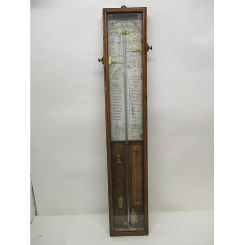 132 - A Victorian Admiral Fitzroy barometer with a printed paper and walnut backing with brass markers, in... 