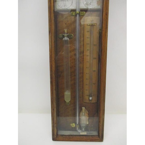 132 - A Victorian Admiral Fitzroy barometer with a printed paper and walnut backing with brass markers, in... 