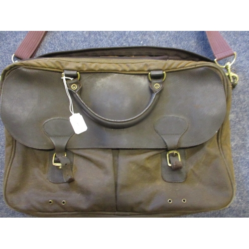 60 - A Barbour wax and leather Tarras messenger bag with a Barbour tartan lining and two large bellow poc... 
