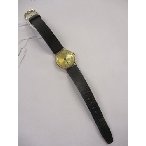 14 - A 1940s 9ct gold gents wristwatch having a 15 jewel movement, the silvered dial (tarnished) having A... 