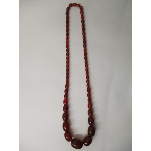 177 - A Bakelite necklace with fifty nine beads, 67g