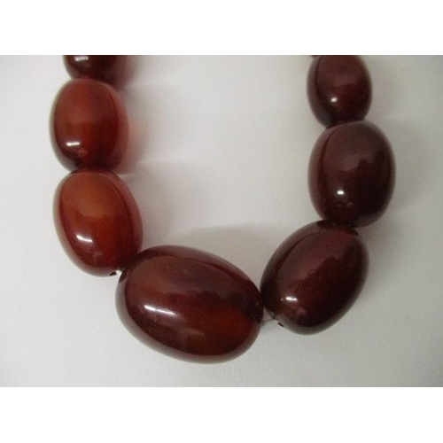 177 - A Bakelite necklace with fifty nine beads, 67g