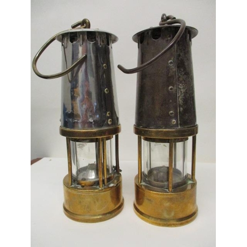 179 - Two Protector Lamp & Lighting Co polished steel and brass miners safety lamps, one Type 6, stamped N... 