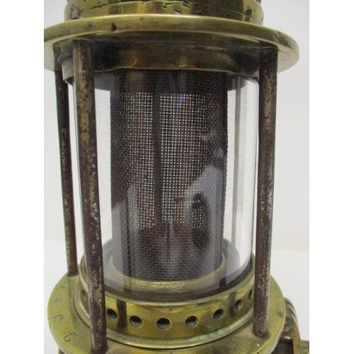 182 - A Patterson 'Donald' steel and brass miners safety lamp with a gauze within a glass panel, 8 1/2