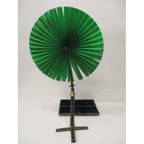 191 - A late 19th century French patinated and gilt metal travellers candle fan, with a green silk panel o... 