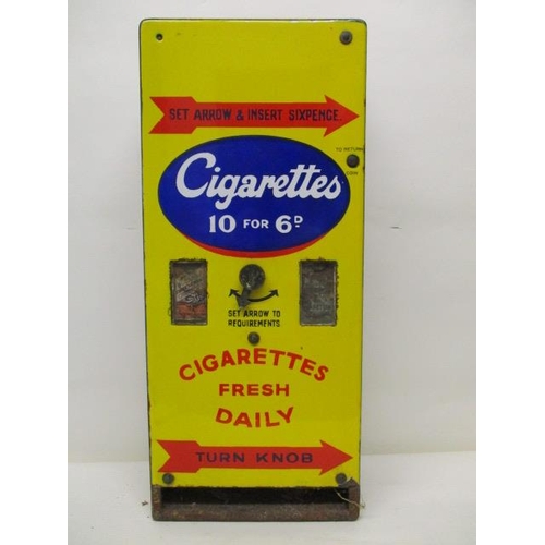 73 - An enamelled and painted cigarette advertising, dispensing machine with black, red, blue and white w... 