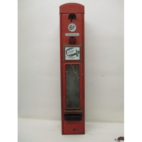 74 - A Wrigley's chewing gum, red painted advertising, dispensing machine   with a coin slot, 6d badge, a... 