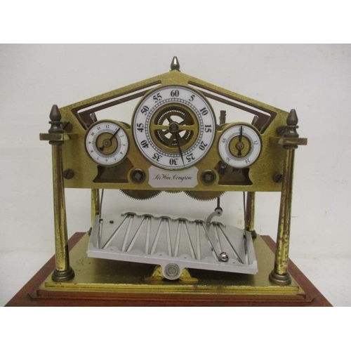 9 - A mid 20th century small Congreve clock bearing a plaque to the front, Sir W M Congreve and having t... 