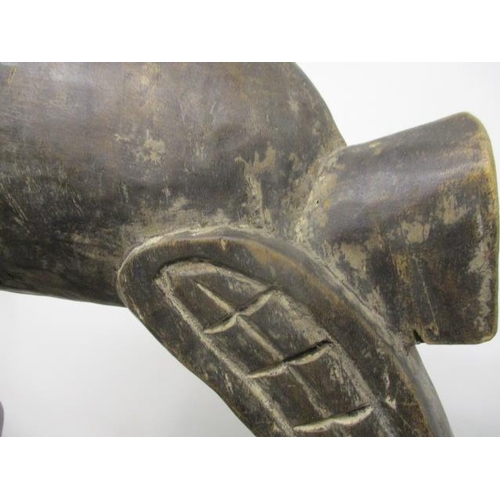 61 - A large antique Polynesian carved, wooden bird with a long beak on a domed foot, 51