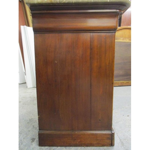 64 - A 19th century French mahogany commode having a marbled top over a cushion moulded drawer and three ... 