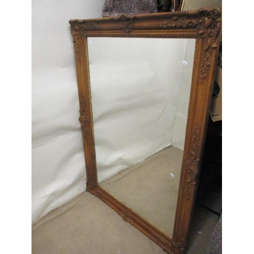 62 - A late Victorian grained gesso picture frame decorated with flowers, foliage and scrolls with a late... 