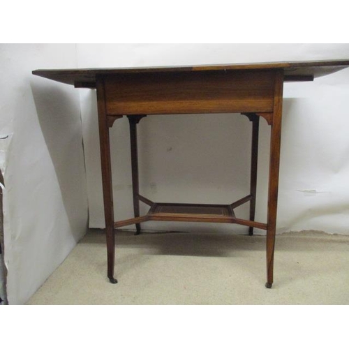 63 - A late Victorian string inlaid, rosewood and marquetry occasional table with twin fall flaps and a d... 