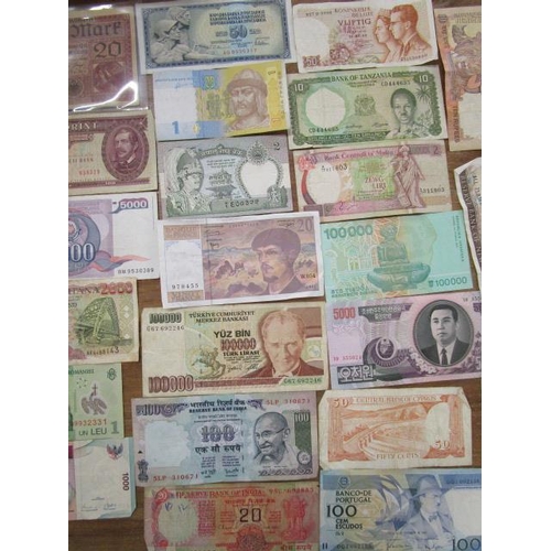 102 - A quantity of various foreign bank notes to include a 50 Pedeset Dinara Republic of Yugoslavia note