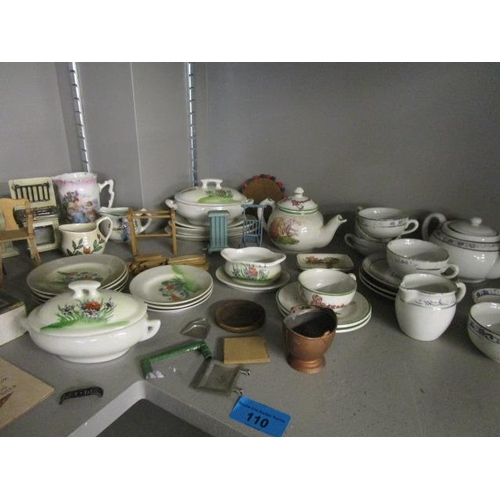 110 - A mixed lot of dolls house furniture, dolls, and childrens' porcelain tea sets to include The Pit A ... 