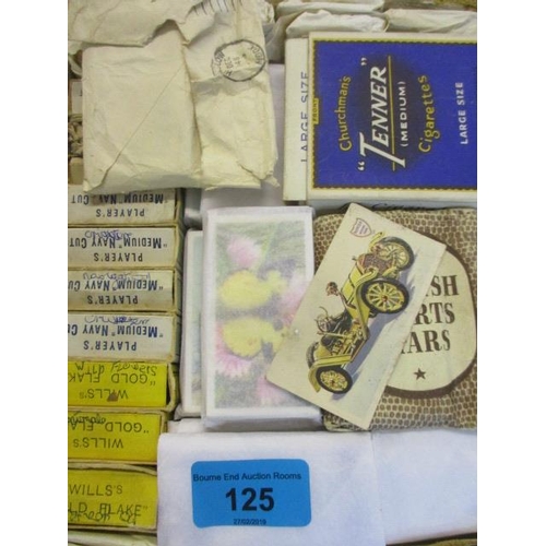 125 - A selection of loose cigarette cards, albums and silks