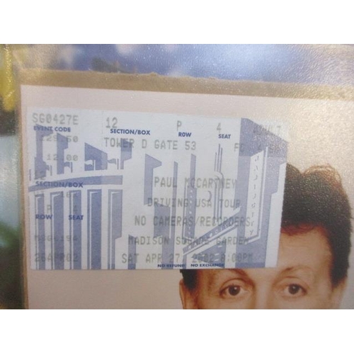 129 - A 2002 Paul McCartney concert ticket, brochure and photograph, together with a Beatles jigsaw puzzle... 