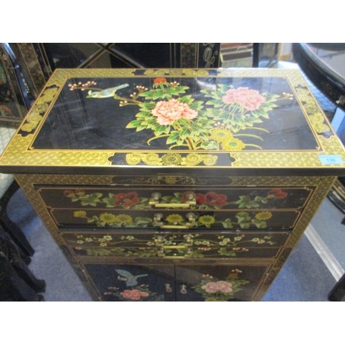 136 - A black chinoiserie two door cabinet with canteen drawers