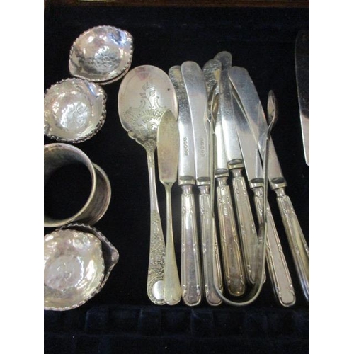 67 - A large quantity of miscellaneous silver plated cutlery and flatware, to include a silver napkin rin... 